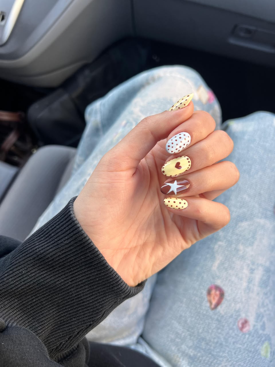 Colorful nail art with polka dots and star design